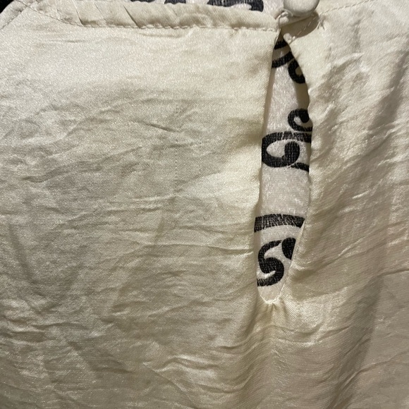 Silky top with black lace trimming on neck area. - Picture 4 of 11